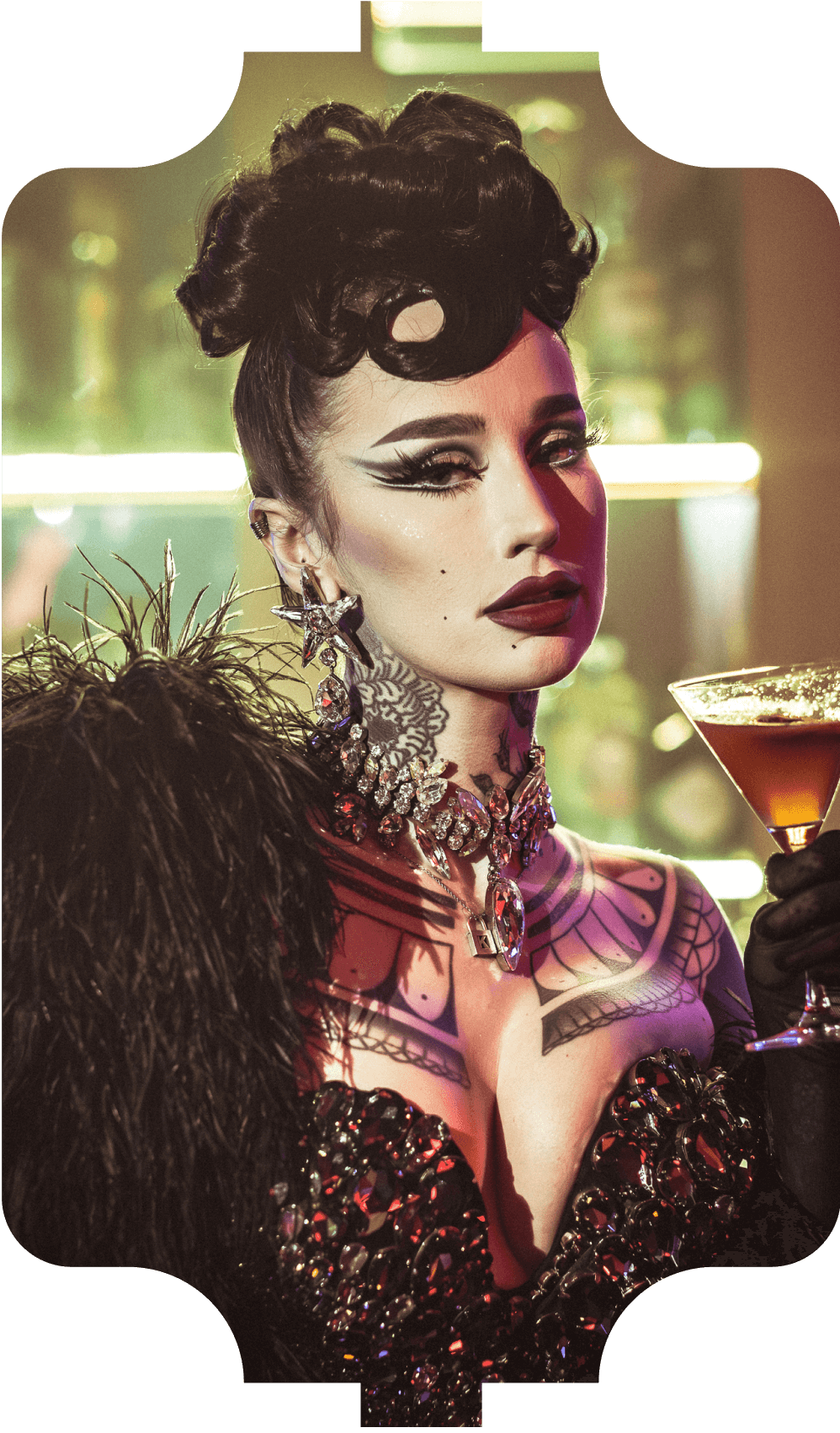 A performer in an ornate red cabaret costume beneath the pavilion's lanterns